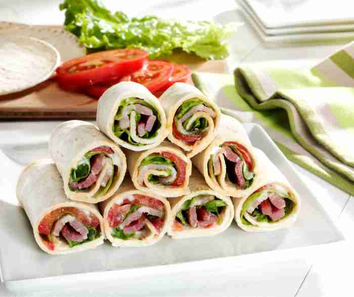 A stack of nine Mini BLT's on a plate.