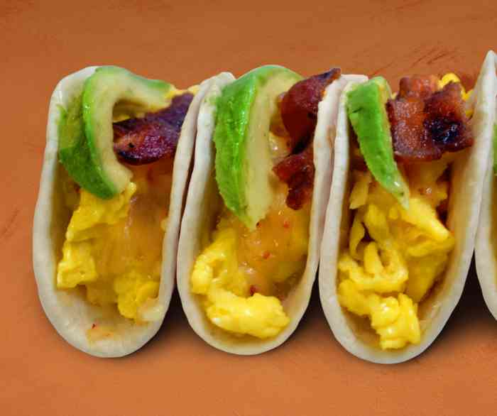 Three Sonoma Breakfast tacos laid out next to each other.